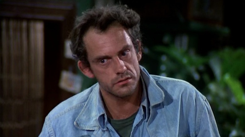 Jim looking down with his head tilted on Taxi S2E3