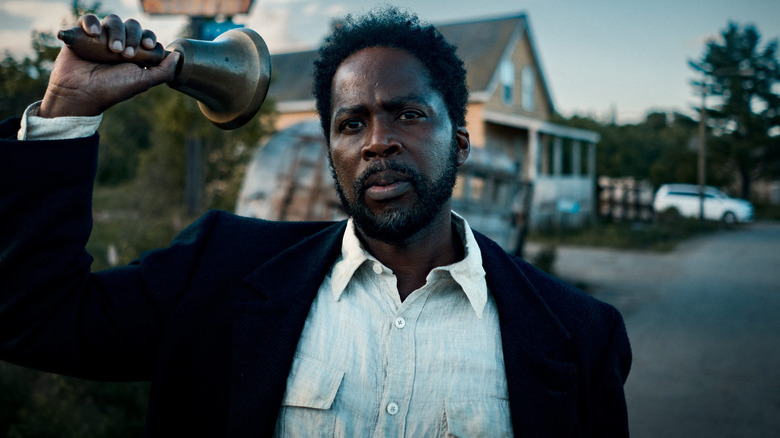 Sheriff Boyd Stevens (Harold Perrineau) rings a bell in From