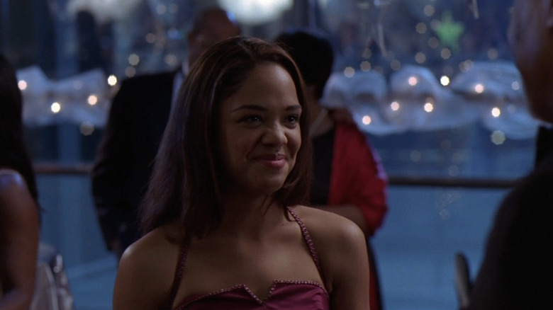 Camille Travis smiling in formal dress