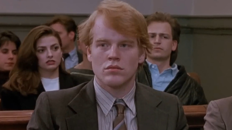 Philip Seymour Hoffman as Steven Hanauer, sitting in court in Law & Order.