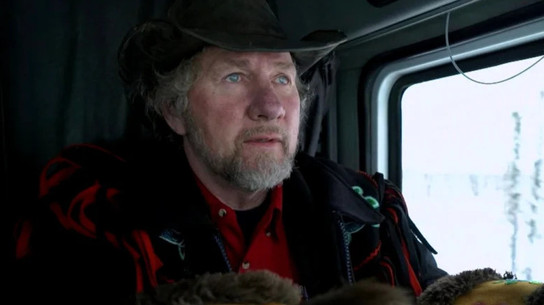 Alex Debogorski sitting in truck in Ice Road Truckers