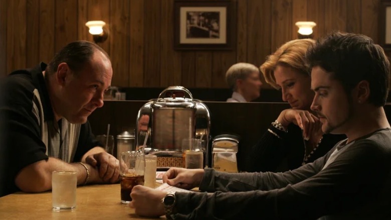 Tony Soprano (James Gandolfini) looking at Carm (Edie Falco) and AJ (Robert Iler) in a diner in The Sopranos