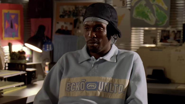 Omar sitting in a police office on The Wire