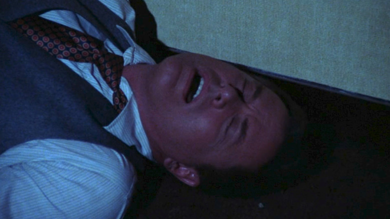 J.R. lies on the ground in "Dallas"