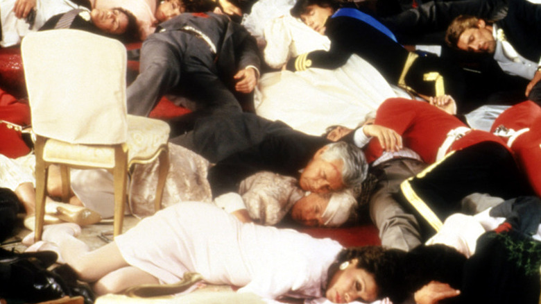 A family lies motionless after a gun fight in "Dynasty"