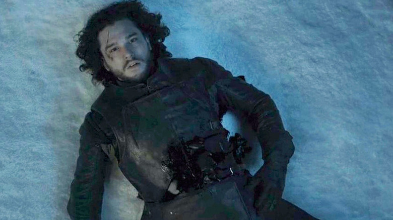 Jon Snow lies in the snow in "Game of Thrones"