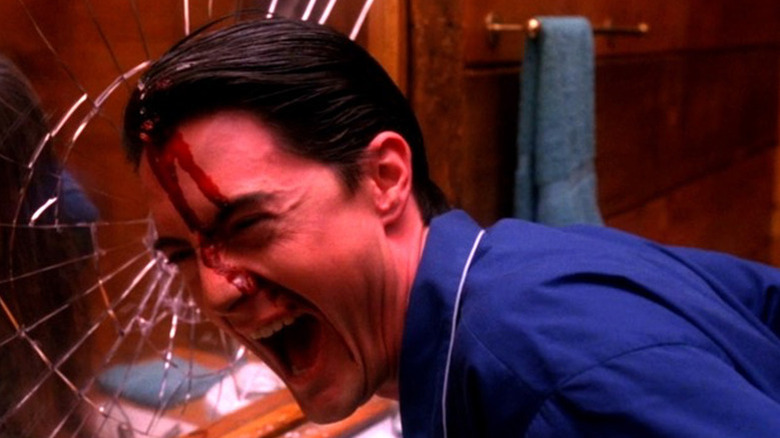 Agent Cooper laughs as blood runs down his forehead in "Twin Peaks"