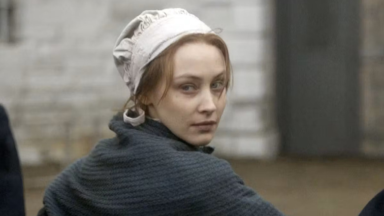 Sarah Gadon as Grace Marks, looking over her shoulder in Alias Grace.