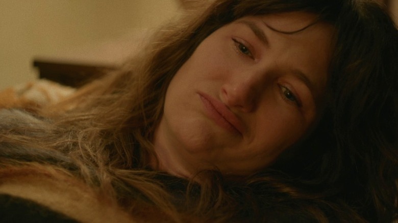 Chris lying on the couch and pursing her lips on I Love Dick S1E3