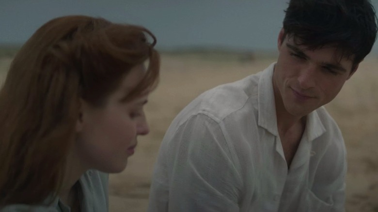 Amy and Dorrigo sitting together on the beach on The Narrow Road to the Deep North S1E3