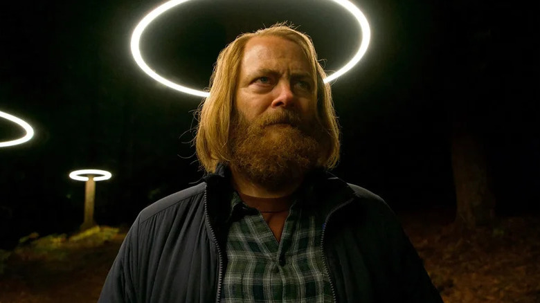 Nick Offerman's Forrest with a halo lamp above his head on Devs