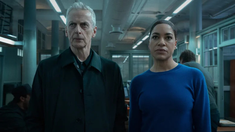 Peter Capaldi as Daniel Hegarty standing next to Cush Jumbo as June Lenker in Criminal Record