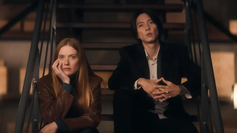 Fleur Geffrier as Camille sitting on stairs next to Tomohisa Yamashita as Issei in Drops of God