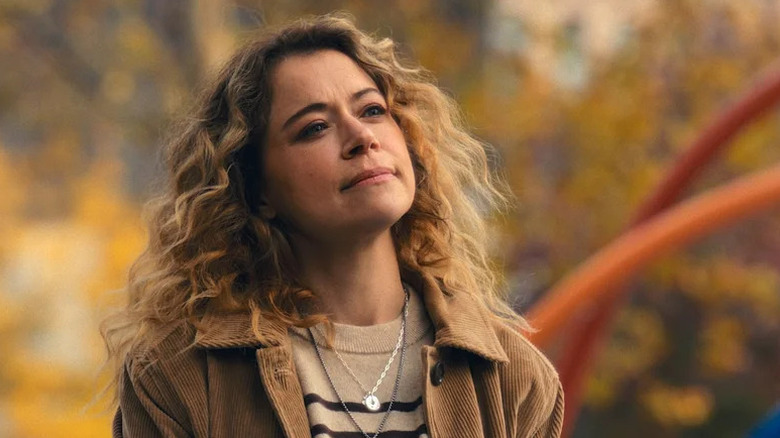 Tatiana Maslany with blonde hair as Paula standing outside in Maximum Pleasure Guaranteed