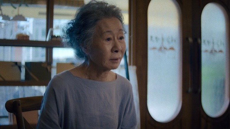 Youn Yuh-jung as Sunja sitting in chair in Pachinko