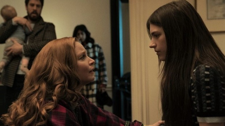 Lauren Ambrose as Dorothy kneeling in front of Nell Tiger Free as Leanne in Servant
