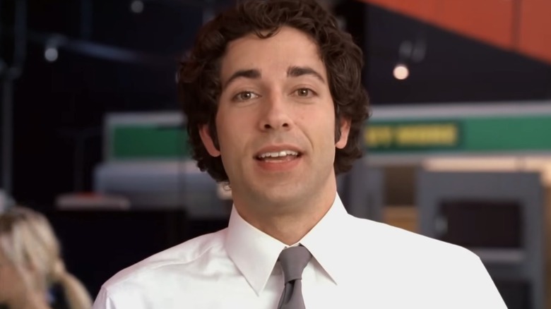 Chuck smiling and speaking while looking at camera