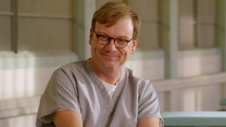 Forrest MacNeil smiling in prison