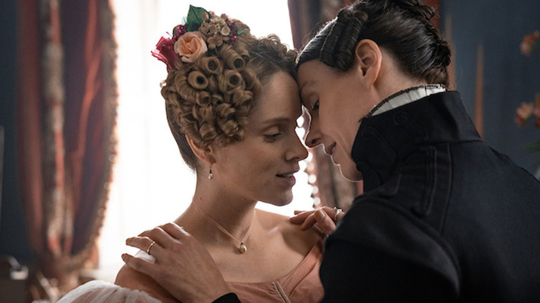 Anne Lister leaning in to kiss Ann Walker