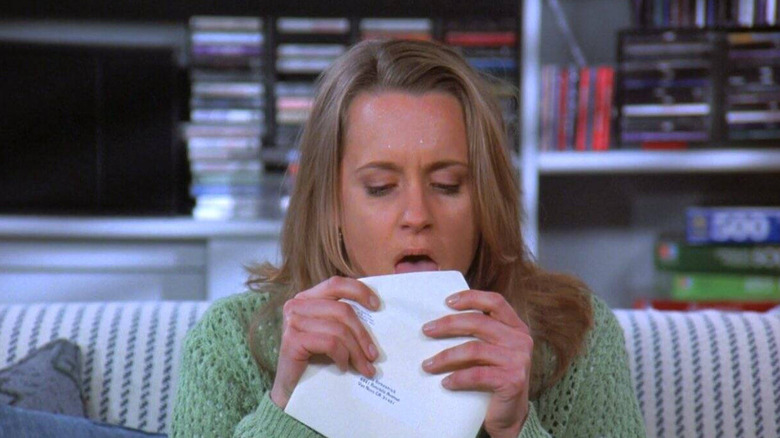 Heidi Swedberg as Susan Ross licks and envelope in Seinfeld