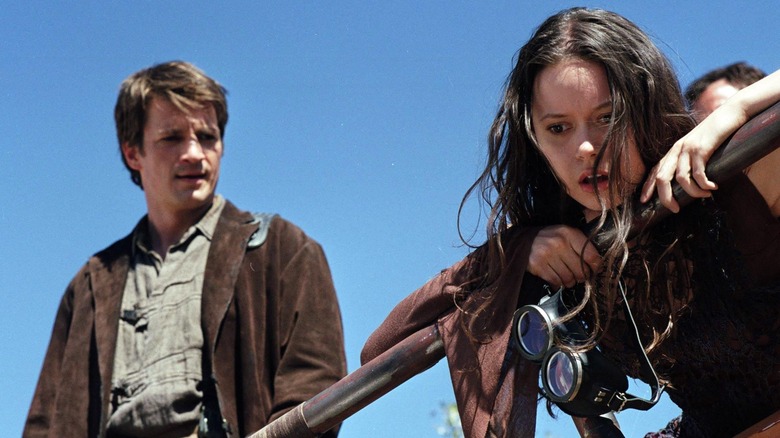 Captain Malcolm (Nathan Fillion) looking concerned for River Tam (Summer Glau) in Serenity