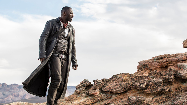 Roland Deschain (Idris Elba) walking in The Dark Tower
