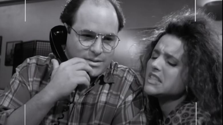 Videotape footage of Jason Alexander as George on the phone while Julia Louis-Dreyfus as Elaine leans into him on Seinfeld