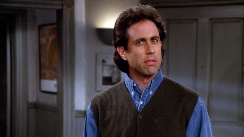 Jerry Seinfeld eyes the camera suspiciously on Seinfeld