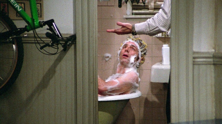 Jerry Seinfeld catches Cosmo Kramer (Michael Richards) taking a bath in his bathroom on Seinfeld
