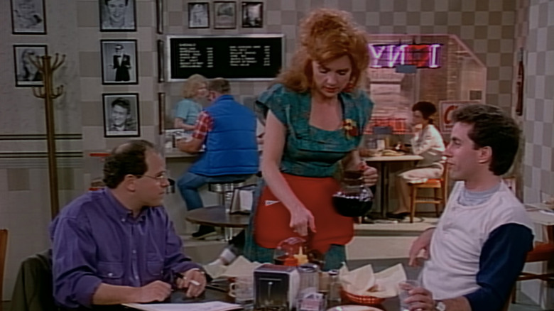 Claire (Lee Garlington) pours George Costanza (Jason Alexander) and Jerry Seinfeld coffee at a diner on Seinfeld