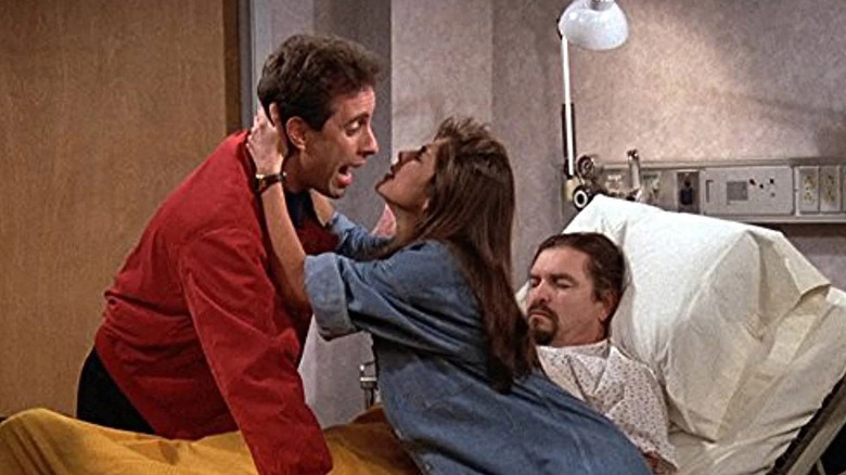 Gina (Gina Gallego) tries to kiss Jerry Seinfeld over Martin (C.E. Grimes) on Seinfeld