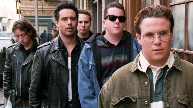 Steve Koren (Jed Rhein) leads the Van Buren Boys down the sidewalk on Seinfeld