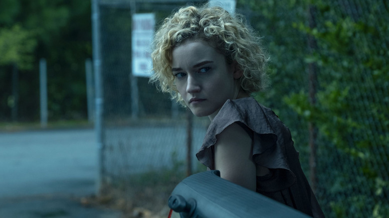 Julia Garner as Ruth looking behind her in Ozark