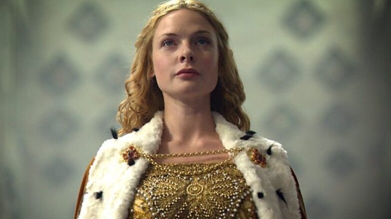 Elizabeth Woodville (Rebecca Ferguson) stands wearing a regal cloak in The White Queen