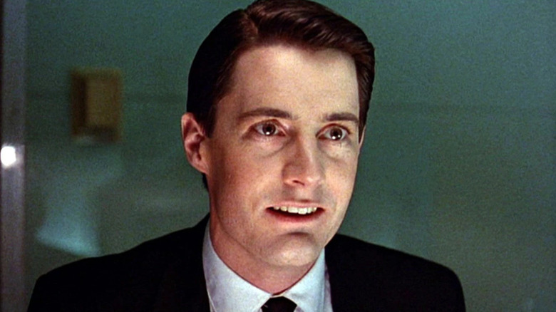 Kyle MacLachlan as Dale Cooper smiles on Twin Peaks