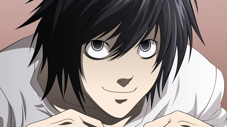 L smiles on Death Note