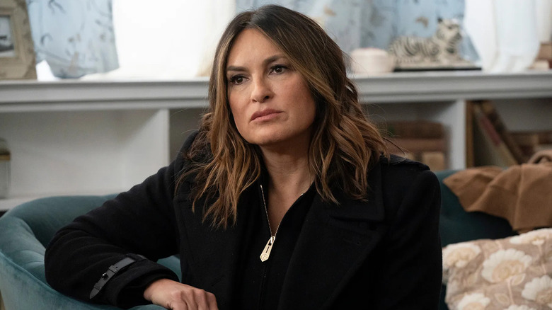 Mariska Hargitay as Olivia Benson sits on a couch on Law & Order: SVU