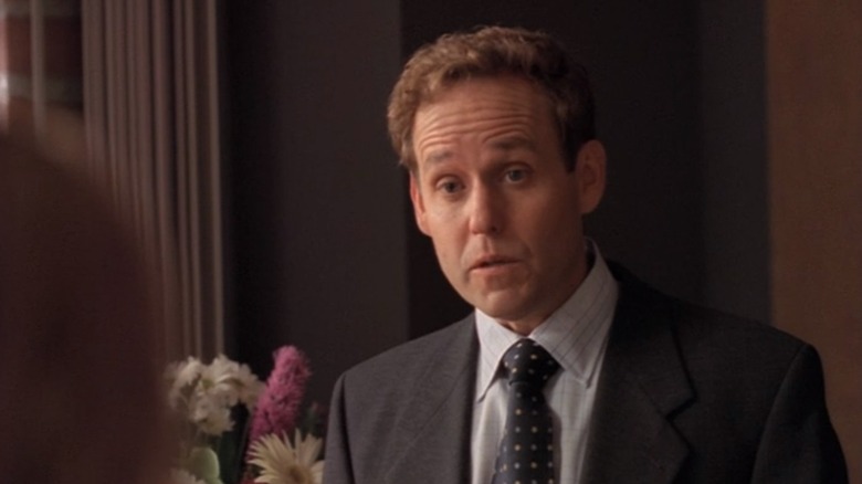 Peter MacNicol as John Cage, tilting his head in Ally McBeal.