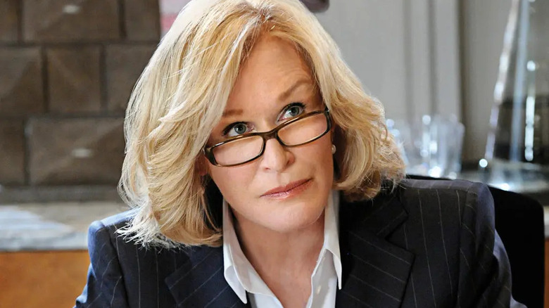 Glenn Close as Patty Hewes, looking over glasses in Damages.