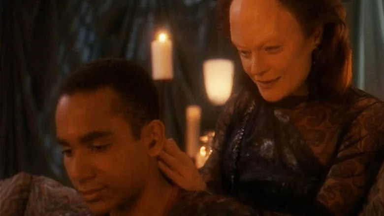Ona (Meg Foster) massages Jake Sisko (Cirroc Lofton) in Star Trek: Deep Space Nine