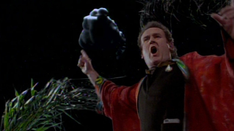 Miles O'Brien (Colm Meaney) wearing weird robs points to a thundercloud in Star Trek: Deep Space Nine