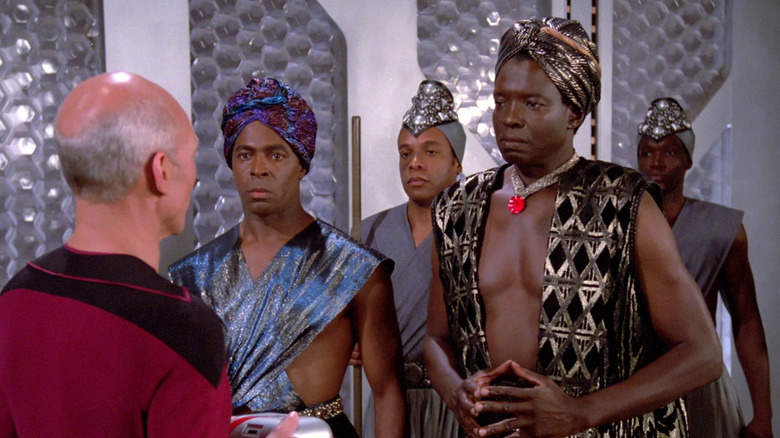 Jean-Luc Picard (Patrick Stewart) meets Lutan (Jessie Lawrence Ferguson) and his entourage on Star Trek: The Next Generation
