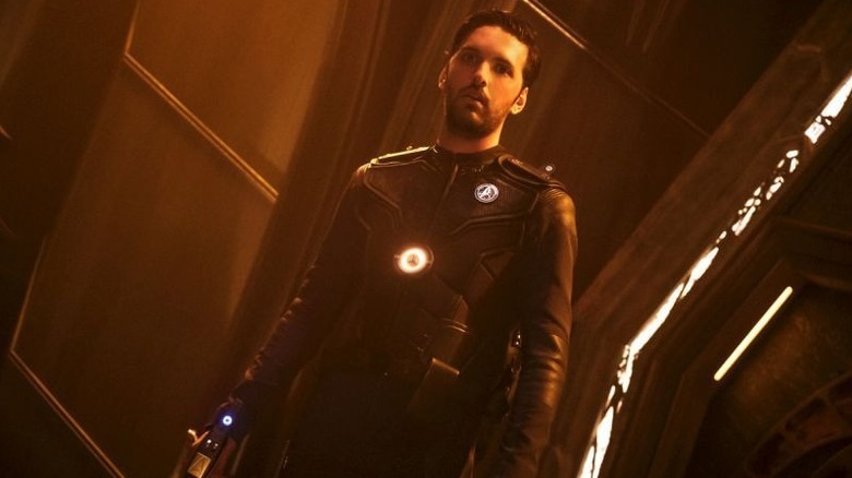 Ash Tyler (Shazad Latif) stands shocked in a hallway on Star Trek: Discovery