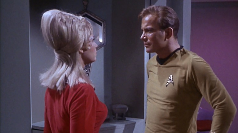 Janice Rand (Grace Lee Whitney) is confronted by Jim Kirk (William Shatner) in her quarters on Star Trek: The Original Series