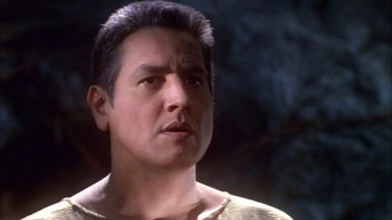 Chakotay (Robert Beltran) stands in a cave in Star Trek: Voyager