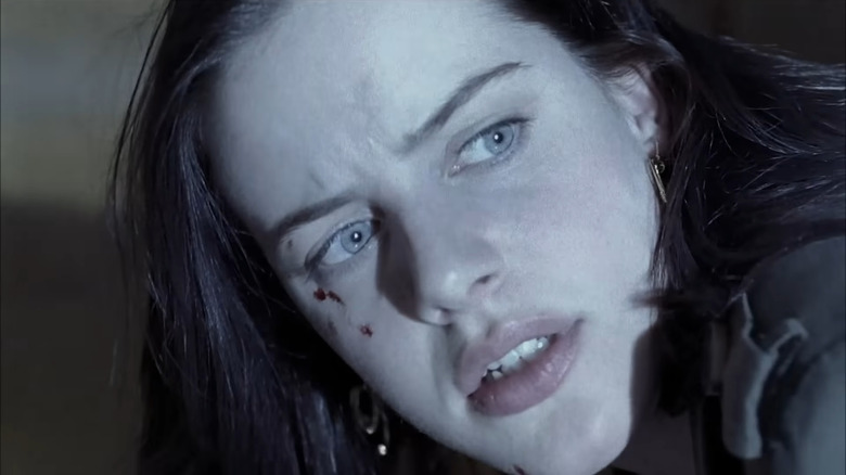 Michelle Ryan's Jaime Sommers looking over her shoulder in Bionic Woman