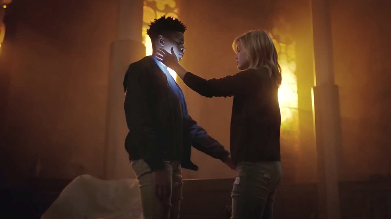 Olivia Holt's Dagger touching Aubrey Joseph's Cloak's face in Cloak & Dagger