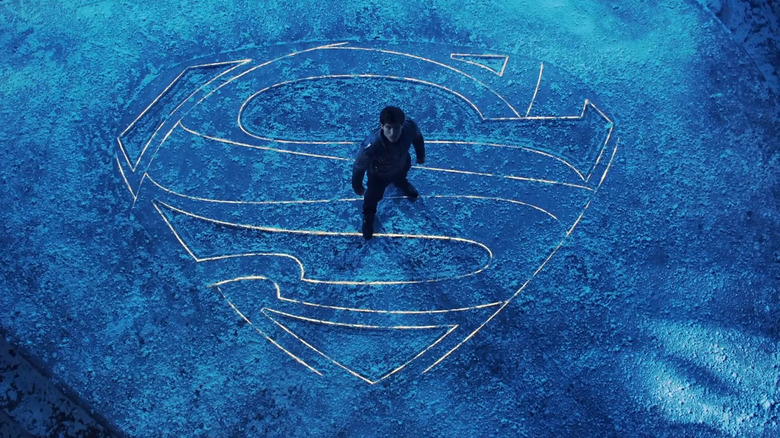 Cameron Cuffe's Seg-El standing on the Superman sigil in Krypton