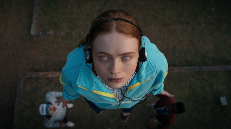 Sadie Sink as Max, levitating with white eyes in Stranger Things.