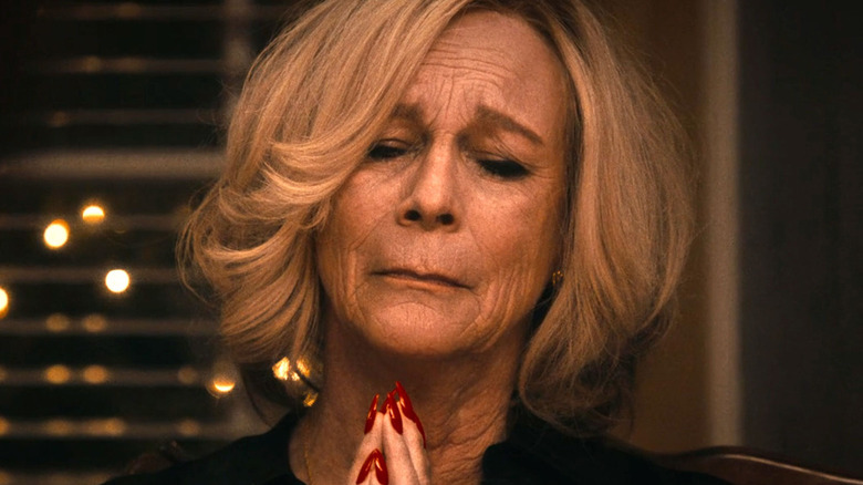 Jamie Lee Curtis as Donna Berzatto, praying with eyes closed in The Bear.